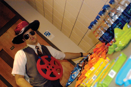 Snack table pimp Mark VanderHarr reaches for a treat at the 2004 Student Film Festival. - Photo by Kristen Nicole Sayres