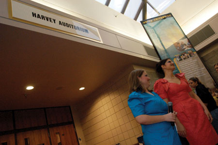 Seniors Becky Johnson and Jodie Curits await the next attendees on the red carpet at the 2004 Student Film Festival.  - Photo by Kristen Nicole Sayres