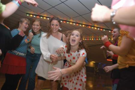Junior Melody Pickerill struggles for balance during 80s Skate Night. - Photo by Jonathan Blair