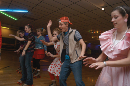 Lindey Abell, Carson Turner, Melody Pickerill, Sally Goulooze and others all bust a move on the skating rink floor at the SAC sponsered 80s Skate Night. - Photo by Jonathan Blair