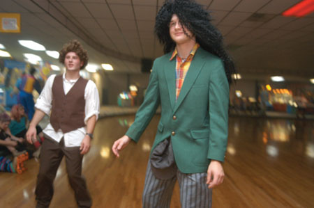 Tyson Cadenhead (right) dons some major hair during 80s Skate Night. - Photo by Jonathan Blair