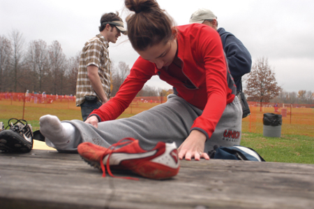 Senior Janelle Royer Campbell stretches before the 2004 NAIA National Cross Country Meet. - Photo by Kristen Nicole Sayres