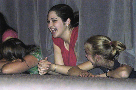 Junior Annie Oliver and other Focus leaders enjoy the Focus Show from a unique perspective during New Student Orientation. - Photo by Kathleen Murray