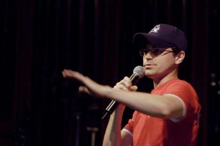 Director of Student Programs and SAC Adviser Justin Phillips welcomes new student at the SAC Game Show during New Student Orientation. - Photo by Kathleen Murray