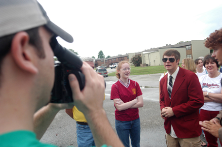 Senior Daniel Holsinger interviews Freshman Holly Foster of Franklin, Tenn. for a LIFE Group video while she and her family wait to sign in at McAfee Commons on Freshman Move-In Day. - Photo by Brad Moore