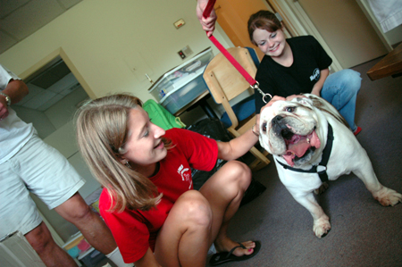 Freshman Lydia Bond gets a chance to meet Buster as he makes the rounds during Freshman Move-In Day. - Photo by Kristen Nicole Sayres