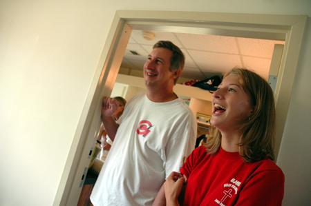 Freshman Lydia Bond, of Madison, Ala., and her father fellowship with her new roommates during Freshman Move-In Day. - Photo by Kristen Nicole Sayres