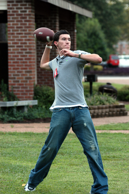 Chase Raines plays a little football with his Focus Group during New Student Orientation. - Photo by Heather Phillips