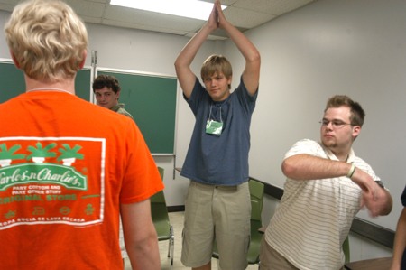 New Students Stephen Carroll (foreground), Kyle Clark, Joshua Brooks, and Joshua Armacost strike poses at one of their Focus sessions during New Student Orientation. - Photo by Brad Moore