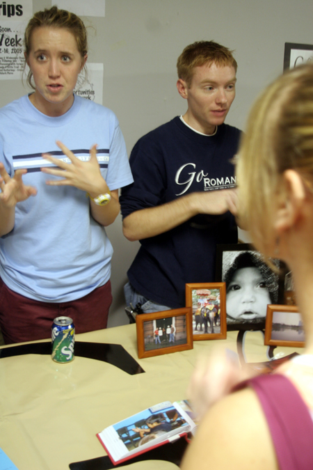 Sophomores Julie Mitchell and Brian Burns describe GO Trips to new students at the Student Life Fair during New Student Orientation. - Photo by Kyle Kurlick