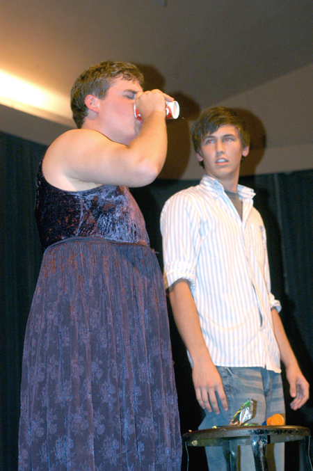 Sophomore Ross Barnes watches as senior Clayton Sanderson downs a cup full of grossness during the Focus Show. - Photo by Brad Moore