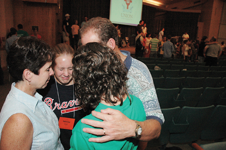During the annual Focus chapel service, new student Jessica Bandy bids farewell to her family as they pray together. This year's freshman class boasts the
largest enrollment in Union history with over 400 students. - Photo by Kristen Nicole Sayres