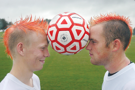 Several players on the men's soccer team recently found a 'colorful' way to show their enthusiam for their upcoming season. The players sported new hair styles in a myriad of cherry reds, sunset oranges and canary yellows. - Photo by Heather Phillips