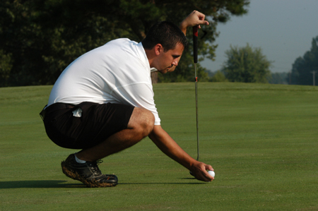 Junior Matt Wood lines up his shot at Hidden Valley golf course in Jackson. With no seniors on the team this year, Wood will provide needed experience to the golf team. - Photo by Heather Phillips