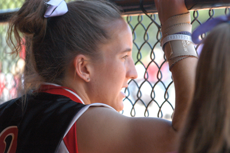 Senior leftfielder Allison Shein cheers her team from the dugout during the TranSouth Conference Tournament. - Photo by Julie Powell
