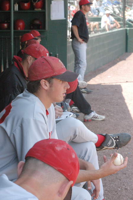 Sophomore pitcher John Mark Walls (with baseball in hand) looks on from the dugout as Union makes their run to the winner's bracket championship in the TranSouth Conference Tournament. - Photo by Steven Aldridge