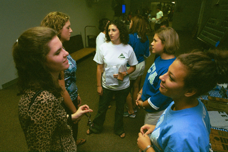 Members of Zeta Tau Alpha tell incoming freshmen about their sorority at the Campus Life Fair during New Student Orientation 2002. - Photo by Kristen Hiller