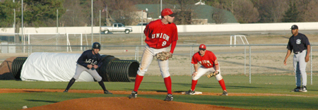 Union's Clint Arthur (9) works from the stretch during the Bulldog's win over Lambuth.  First baseman, Josh Allen (11) holds the runner. - Photo by Steven Aldridge