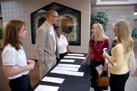 Enrollment counselors Crystal Skelton, Ronnie Smith, and Crystal Taylor welcome Holly Gushee and her mother to Union's campus on Preview Day. - Photo by Brad Moore