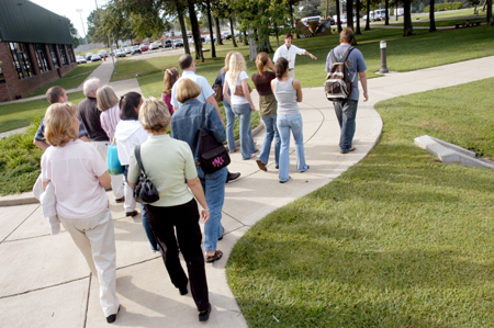 Ross Barnes leads his group of perspective students outside during their campus tour. - Photo by Brad Moore
