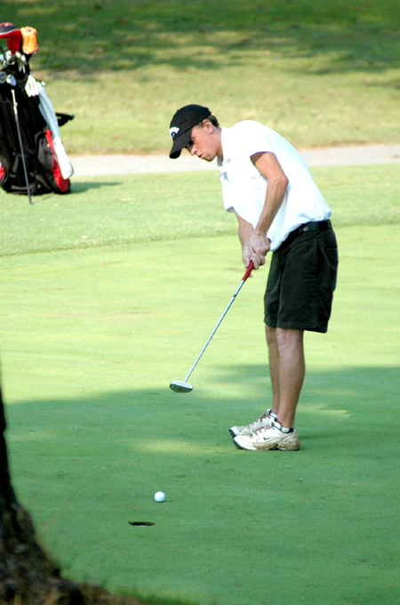 Mickey Armstrong watches a putt he sank at the 18th hole to finish his round in the Union University/Hidden Valley Invitational. - Photo by Steven Aldridge