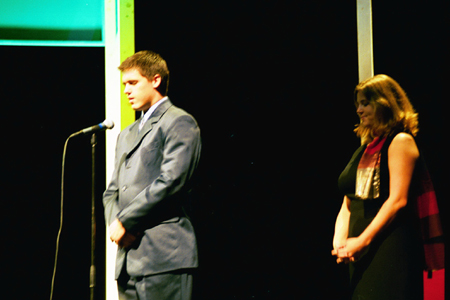 Senior Class President Casey Stafford leads in prayer at the Sixth Annual Scholarship Banquet. - Photo by Jim Veneman