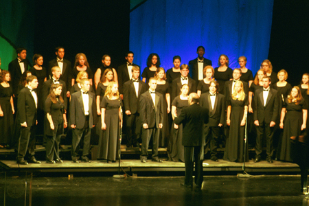 The University Singers, under the direction of music department chair Richard Joiner, perform at the Sixth Annual Scholarship Banquet. - Photo by Jim Veneman