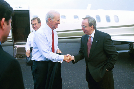 President David S. Dockery greets James Baker as he arrives at the McKeller-Sipes Airport in Jackson. - Photo by Jim Veneman