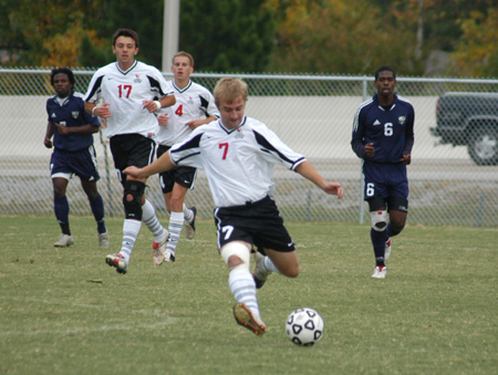 Sophomore Craig Clark keeps the ball moving up field with this kick during Union's 4-1 win over Missouri Baptist University. - Photo by Steven Aldridge