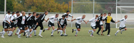 The entire men's soccer team, as they do after ever match, gathers and sprints toward the Union student section in appreciation for their support.  This following Union's 4-1 win over Missouri Baptist. - Photo by Steven Aldridge
