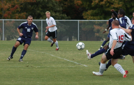 Junior Gareth Munro (19) kicks the ball towards Mark Forrest (8) for what would be Union's first tally during Union's 4-1 win over Missouri Baptist University.  For Forrest, this goal was his first career goal. - Photo by Steven Aldridge