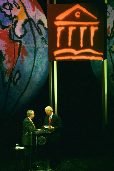 President Dockery welcomes former Secretary of State James Baker to the stage during the Sixth Annual Scholarship Banquet. - Photo by Jim Veneman