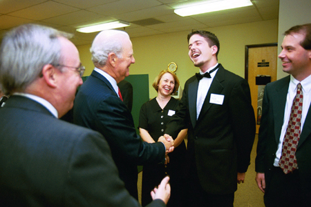 President Dockery introduces Dr. Ann Livingstone, Sophomore Matt Dickey, Dr. Sean Evans to James Baker before the Sixth Annual Scholarship Banquet. - Photo by Jim Veneman