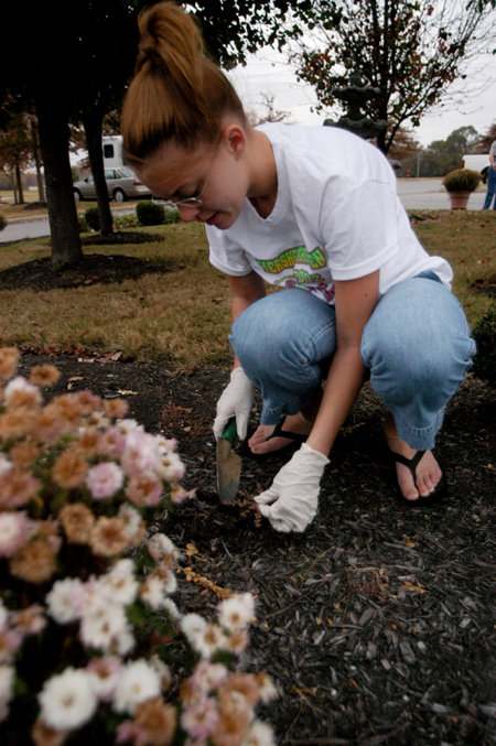 Zeta Sarah Patch worked on a landscaping project at the Cheyenne Trace Senior Living Center during her Day of Remembrance service project. - Photo by Heather Phillips