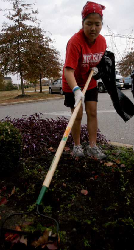 Nursing major Amber Boyd worked on a landscaping project at Cheyenne Trace Senior Living Center during her Day of Remembrance service project. - Photo by Heather Phillips