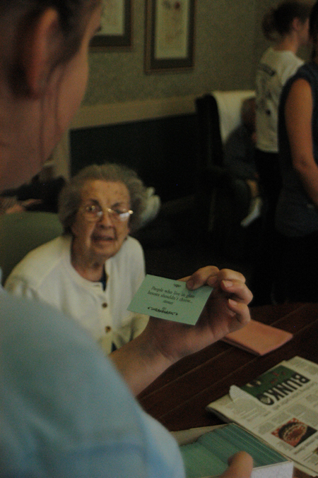 During Day of Remembrance, a resident of a local nursing home enjoys the company of several Union students. - Photo by Heather Phillips