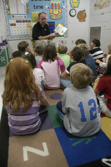 Mark Kahler, associate vice president for university communicaitons, spent his Day of Remembrance at Jackson Christian School reading to children. - Photo by Kathleen Murray
