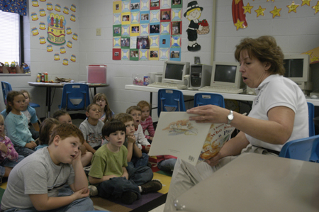 Cindy Kahler, department secretary, spent her Day of Remembrance at Jackson Christian School reading to children. - Photo by Kathleen Murray