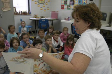 Cindy Kahler, department secretary, spent her Day of Remembrance at Jackson Christian School reading to children. - Photo by Kathleen Murray