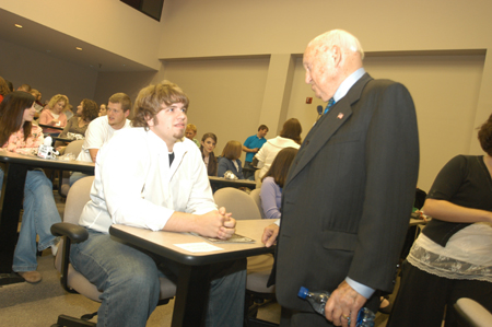 Chick-fil-A founder Truett Cathy visits with Union student Kevin Roe prior to Cathy's Nov. 1 address to Union students. - Photo by Morris Abernathy