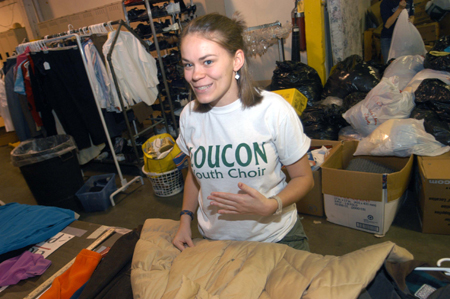 Junior Julie Palmer seperated clothing at RIFA during Alpha Psi Omega's Day of Remembrance service project. - Photo by Morris Abernathy