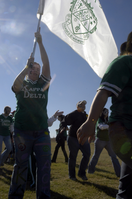 Junior Kim Kurz leads the ladies of Kappa Delta onto the field at the start of the Greek Olympics. - Photo by Kathleen Murray