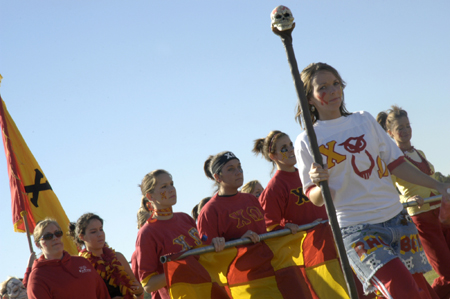 A stoic group of Chi Omegas enter the field in preparation for the Greek Olympics. - Photo by Kathleen Murray