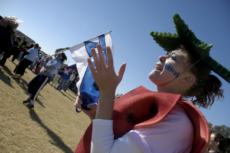Sophomore Sarah Patch and her sisters cheer on the Zetas at the Greek Olympics. - Photo by Kathleen Murray