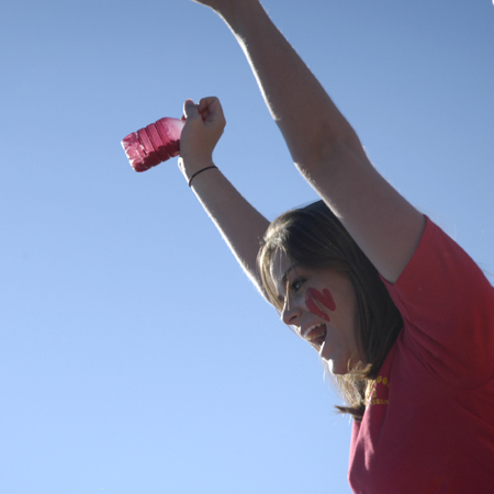 Junior Lauren Cowles cheers on her Chi Omega sisters during the Greek Olympics. - Photo by Kathleen Murray