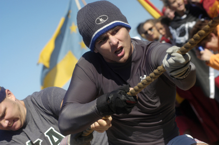 Lambda Chi Ian Ellis gives it his all during the tug of war at the Greek Olympics. - Photo by Kathleen Murray