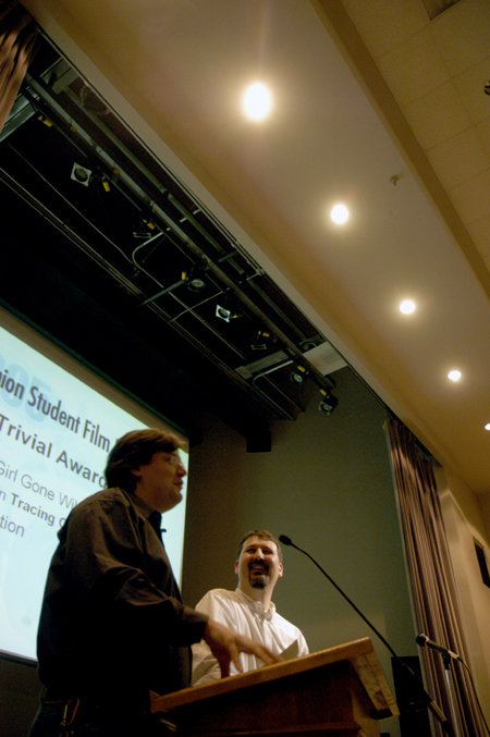 Film Studies Coordinator Chris Blair and Festival Director Cam Tracy present the Trivial Awards during the Third Annual Student Film Festival. - Photo by Kathleen Murray