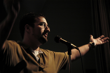 Sophomore Filmmaker Aaron Hardin accepts the Trivial Award for Best Creepout for the ending of his film <i>Development</i> during the Third Annual Union Student Film Festival. - Photo by Kathleen Murray