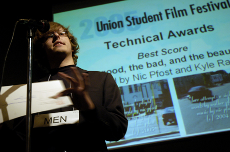 Senior Filmmaker Nic Pfost accepts the award for Best Score for his film <i>the good, the bad, and the beautiful</i> during the Third Annual Union Student Film Festival. The film also won The Students' Choice Award. - Photo by Kathleen Murray