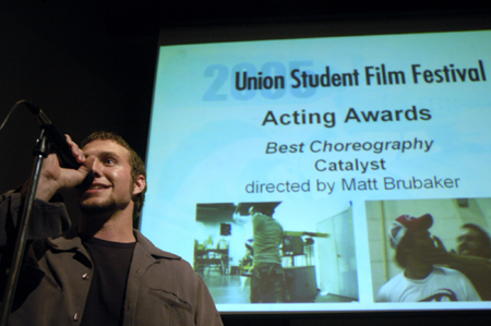 Senior Filmmaker Matt Brubaker accepts the award for Best Choreography for his film <i>Catalyst</i> during the Third Annual Union Student Film Festival. - Photo by Kathleen Murray